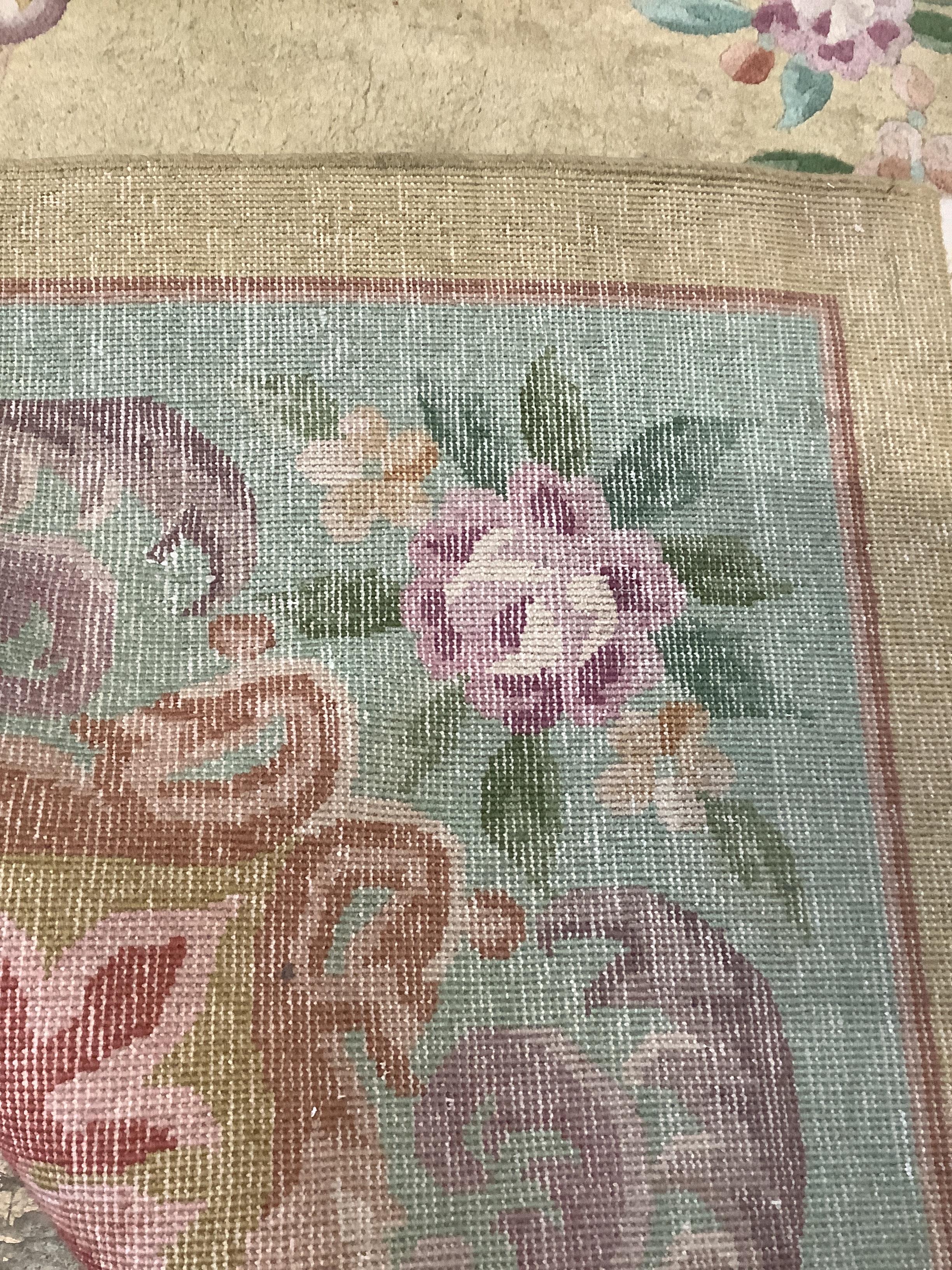 A Chinese gold ground carpet, 360 x 270cm